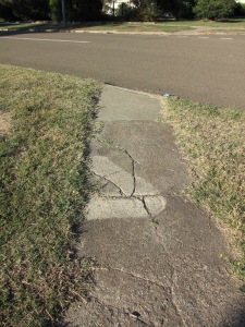cracked path with no kerb crossing